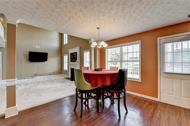 a bathroom with a granite countertop sink and a large mirror
