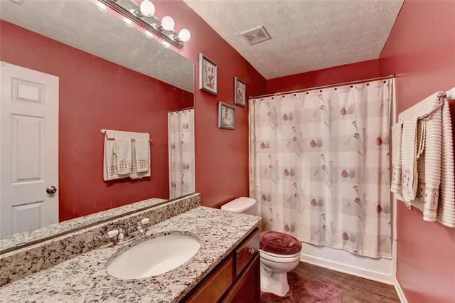 a view of balcony with wooden floor
