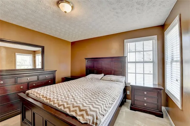 a view of a roof deck with table and chairs and wooden floor