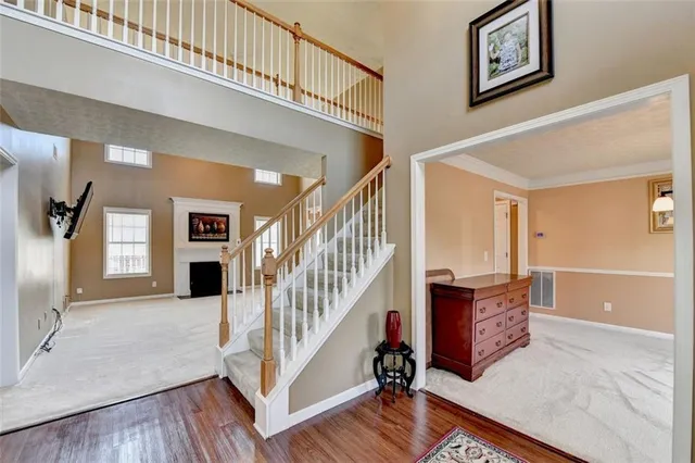 a view of empty room with fireplace and tv