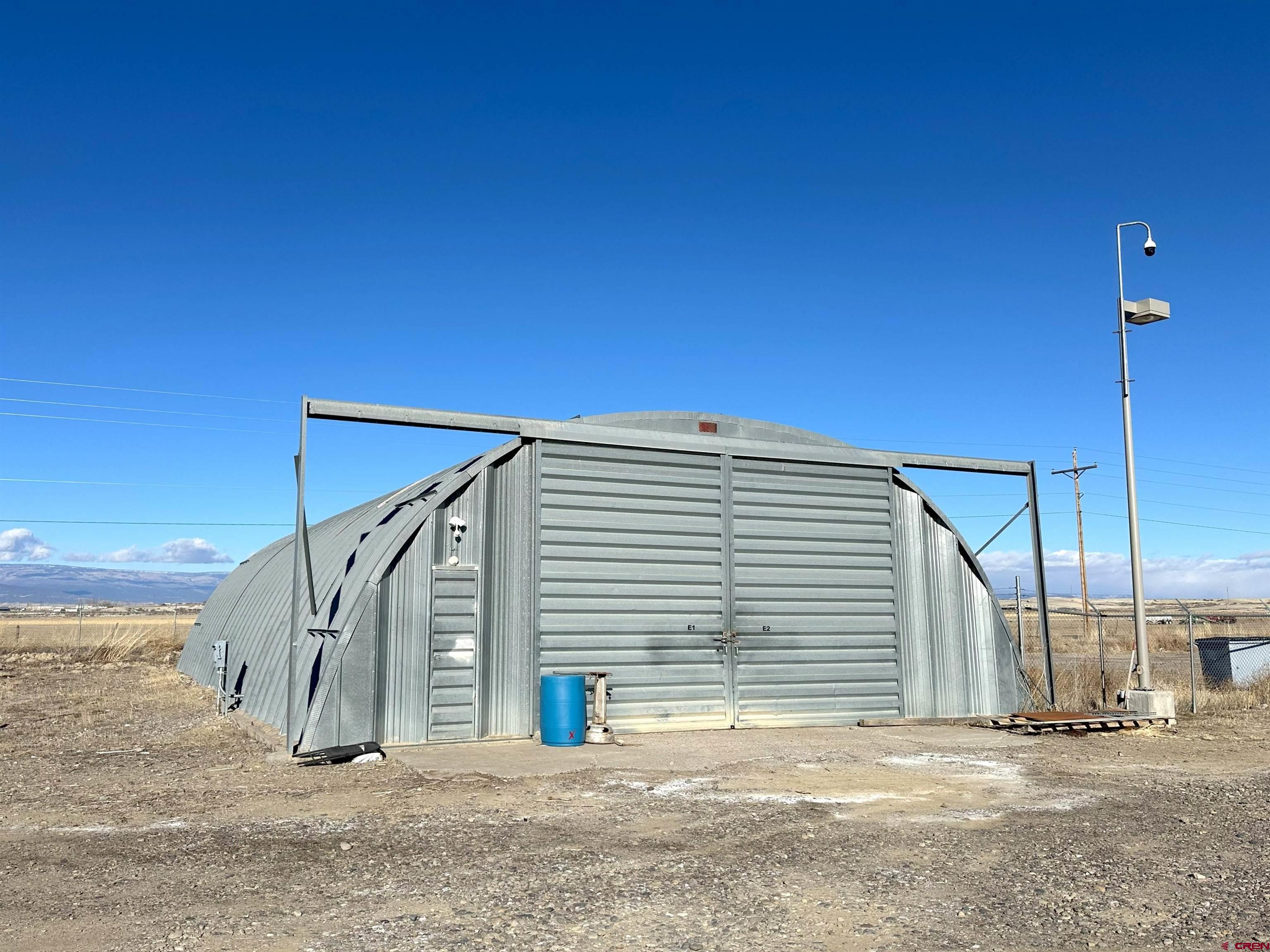 18668 B50 Road, Unit BUILDING E Delta, CO 81416 - Photo 1 of 5 a view of a house with a patio