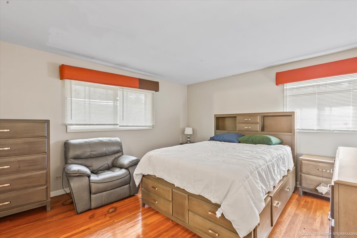18847 May Avenue Homewood, IL 60430 - Photo 17 of 26 a bedroom with a bed and a couch