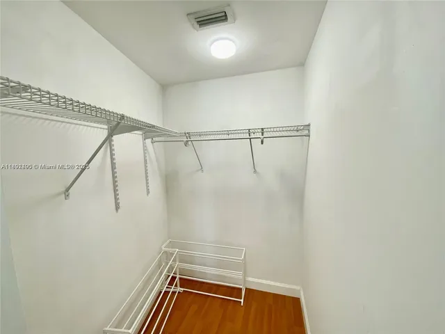 a bathroom with a shower and a sink