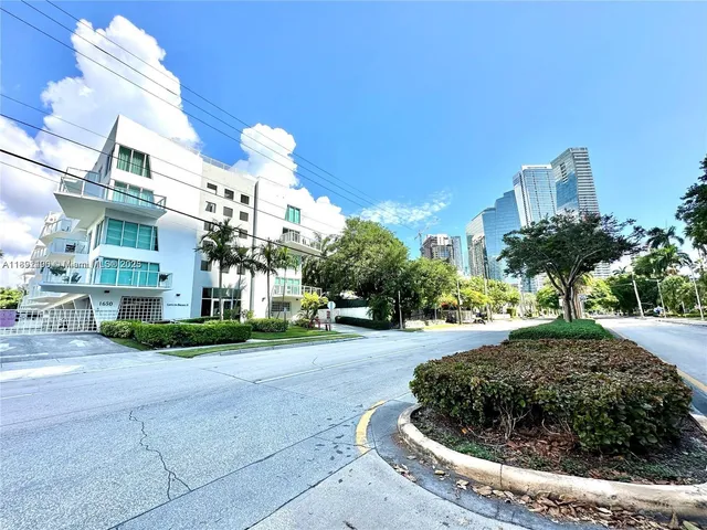 a view of a house with a yard and garage
