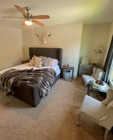 a bedroom with a bed and furniture