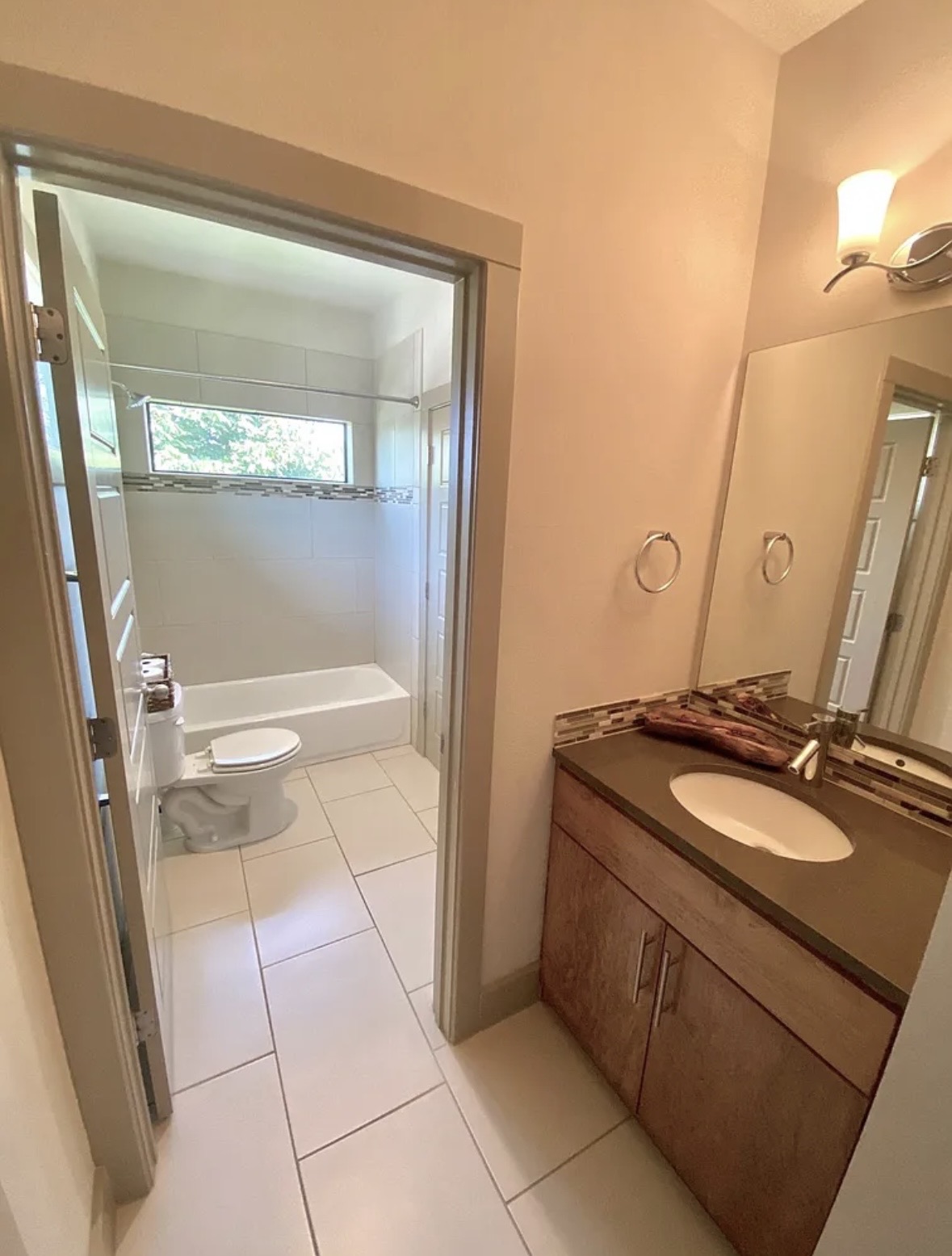 903 Cardinal Lane, Unit A Austin, TX 78704 - Photo 18 of 23 Full bathroom with vanity, light tile patterned floors, and bathtub / shower combination