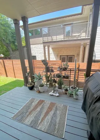 a view of a patio with wooden floor