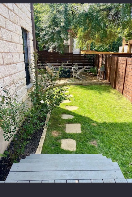 903 Cardinal Lane, Unit A Austin, TX 78704 - Photo 21 of 23 Fenced backyard featuring a deck