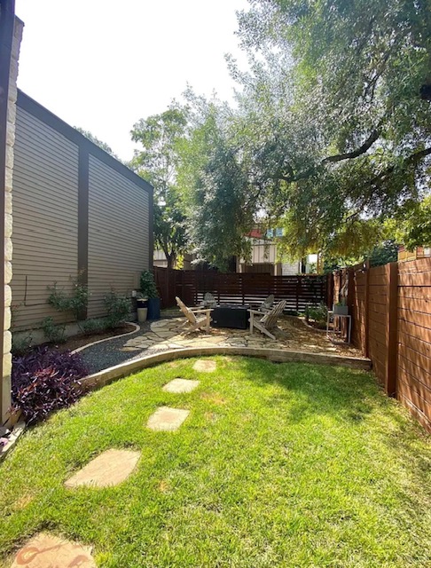 903 Cardinal Lane, Unit A Austin, TX 78704 - Photo 22 of 23 Fenced backyard featuring a patio
