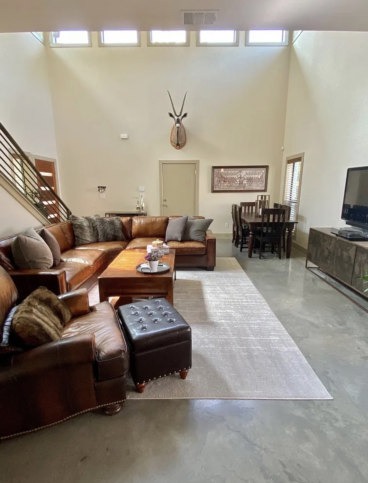 903 Cardinal Lane, Unit A Austin, TX 78704 - Photo 6 of 23 Living area with finished concrete floors and a high ceiling