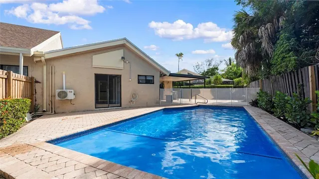 a view of an outdoor space with swimming pool