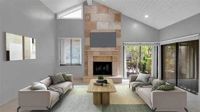 a living room with furniture and a fireplace