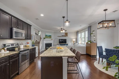 a bathroom with a tub shower and sink