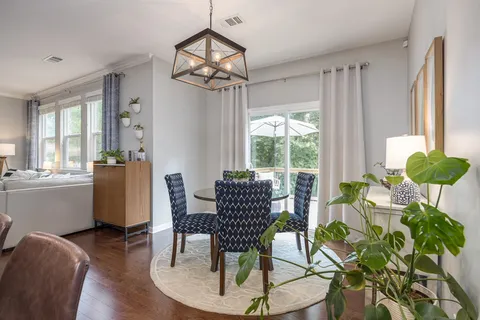 a bedroom with furniture and a wooden floor