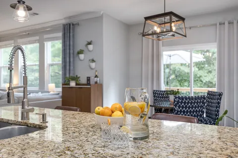 a bedroom with a bed and a night stand