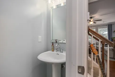 a view of backyard of house with outdoor seating and green space