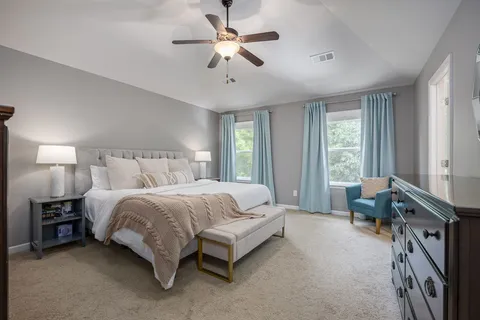 a view of a house with a small deck and a yard