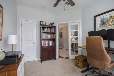 a large kitchen with a table and chairs