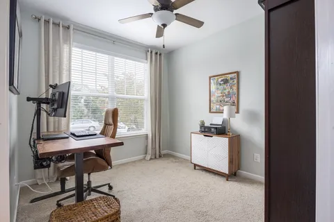 a kitchen with stainless steel appliances granite countertop a sink a stove and cabinets