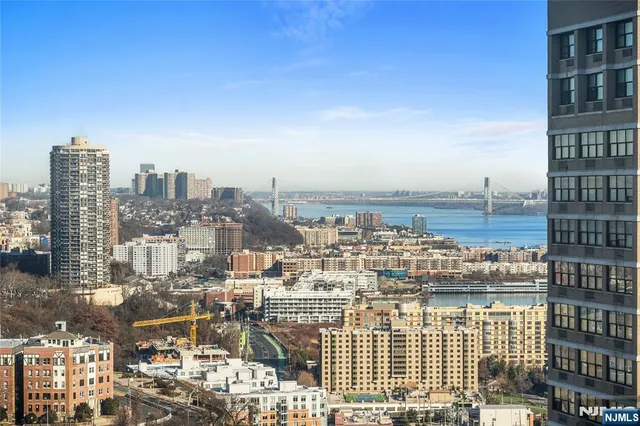 a view of a city with tall buildings