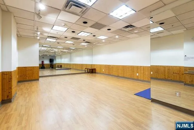 a view of a room with a kitchen