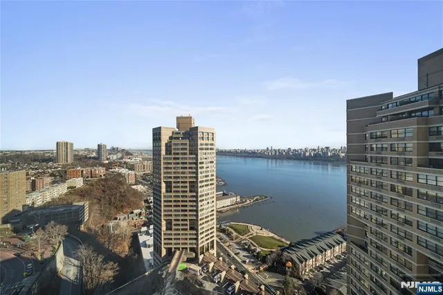 a view of a city with tall buildings in front of it