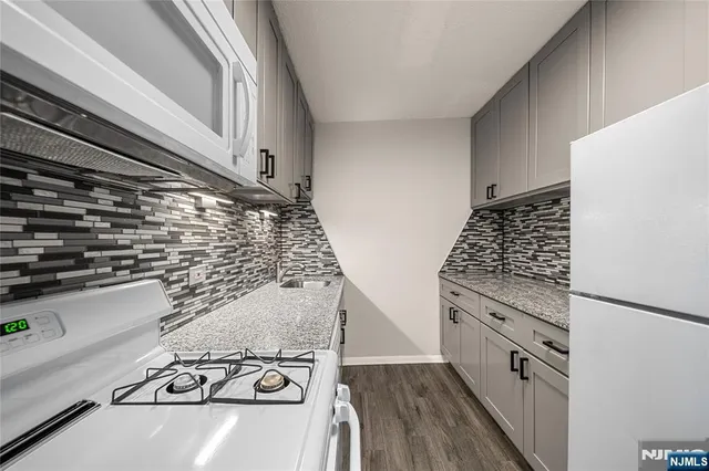 a kitchen with a stove and a microwave