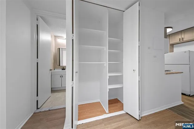 a view of a bathroom with wooden floor