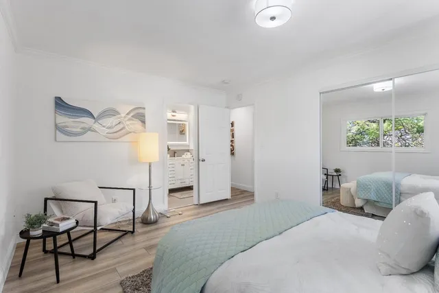 a bedroom with a bed and window