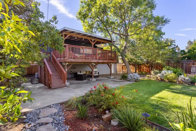 a sign that is in front of flowers