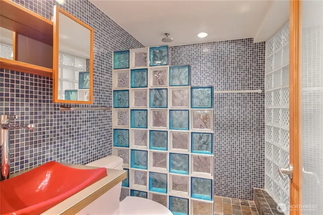 a bathroom with a bathtub and a shower