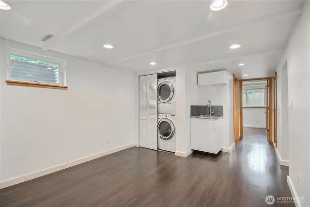 a view of a kitchen with a refrigerator a stove top oven