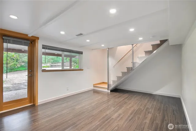 a view of entryway with wooden floor