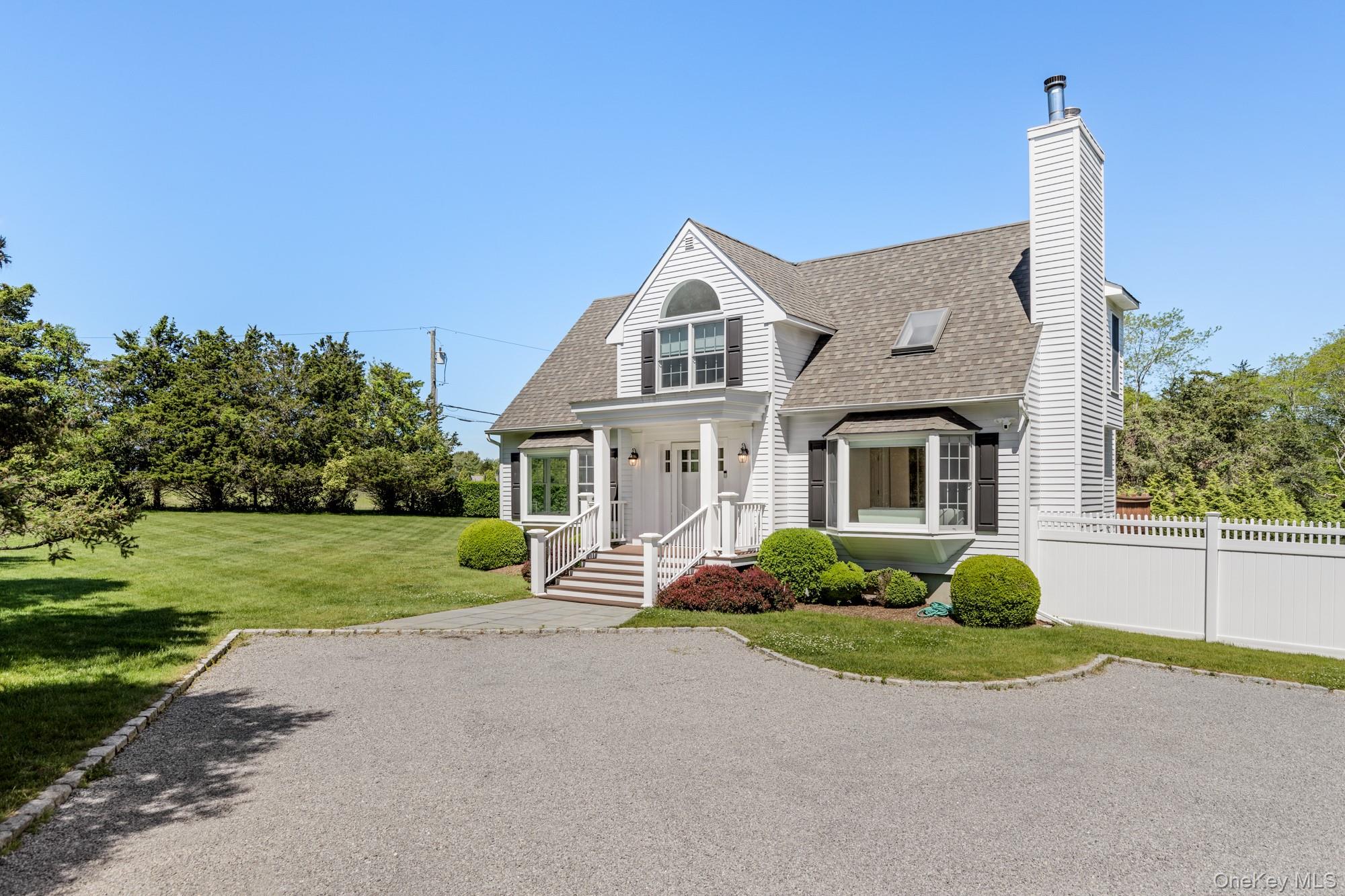 5 Lower 7 Ponds Road Water Mill, NY 11976 - Photo 15 of 35 View of front of home featuring a shingled roof and a chimney