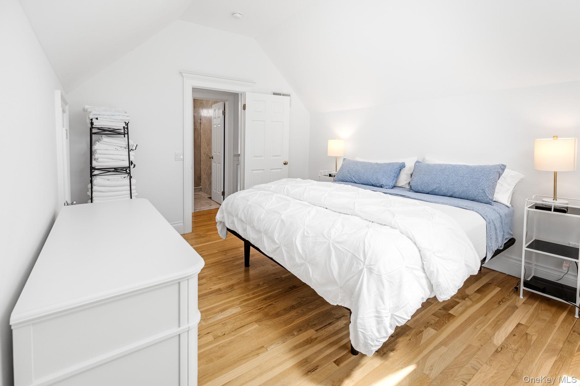 5 Lower 7 Ponds Road Water Mill, NY 11976 - Photo 22 of 35 Bedroom featuring vaulted ceiling and light wood-style flooring