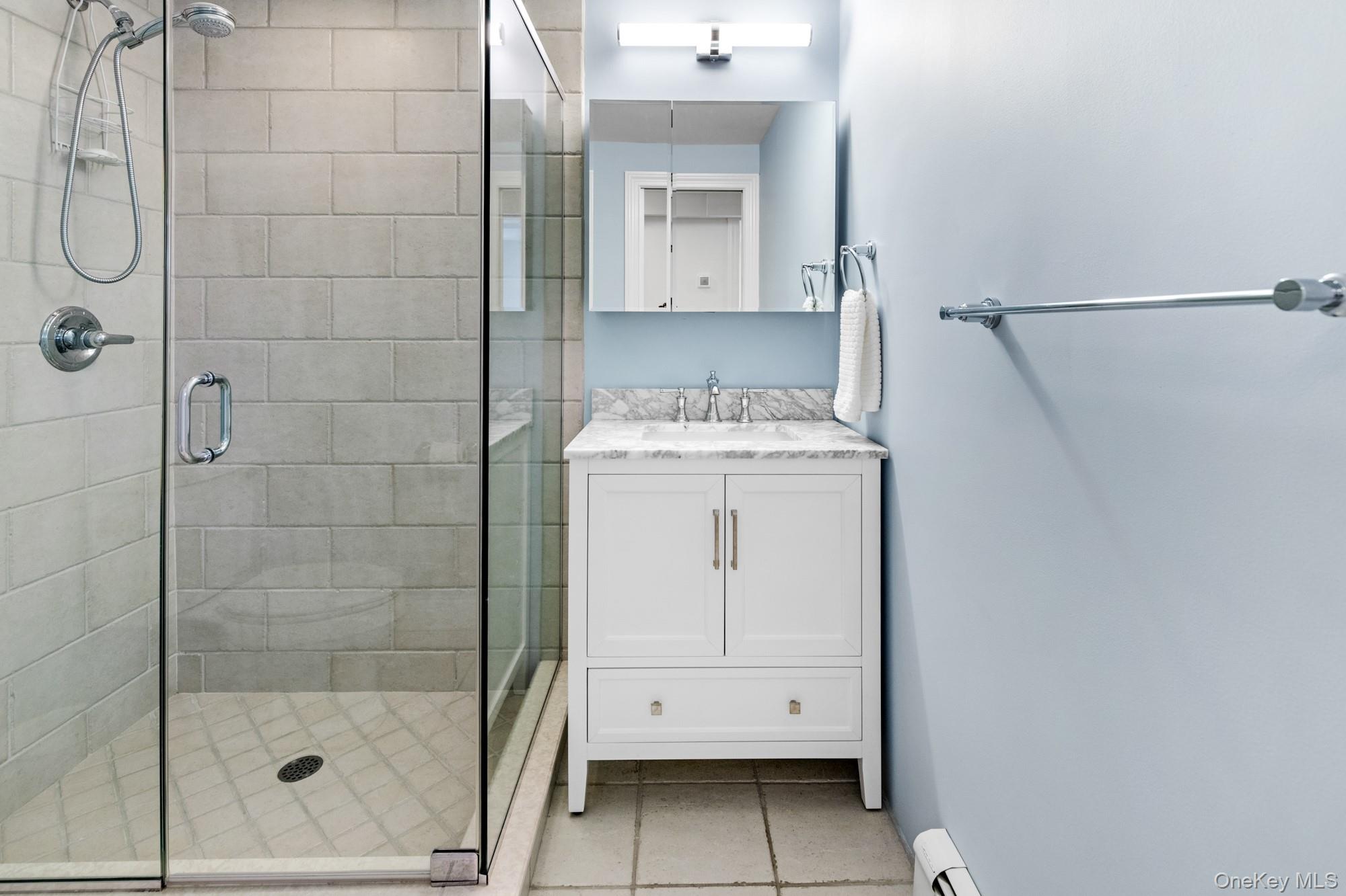 5 Lower 7 Ponds Road Water Mill, NY 11976 - Photo 27 of 35 Full bathroom with a shower stall, tile patterned flooring, and vanity