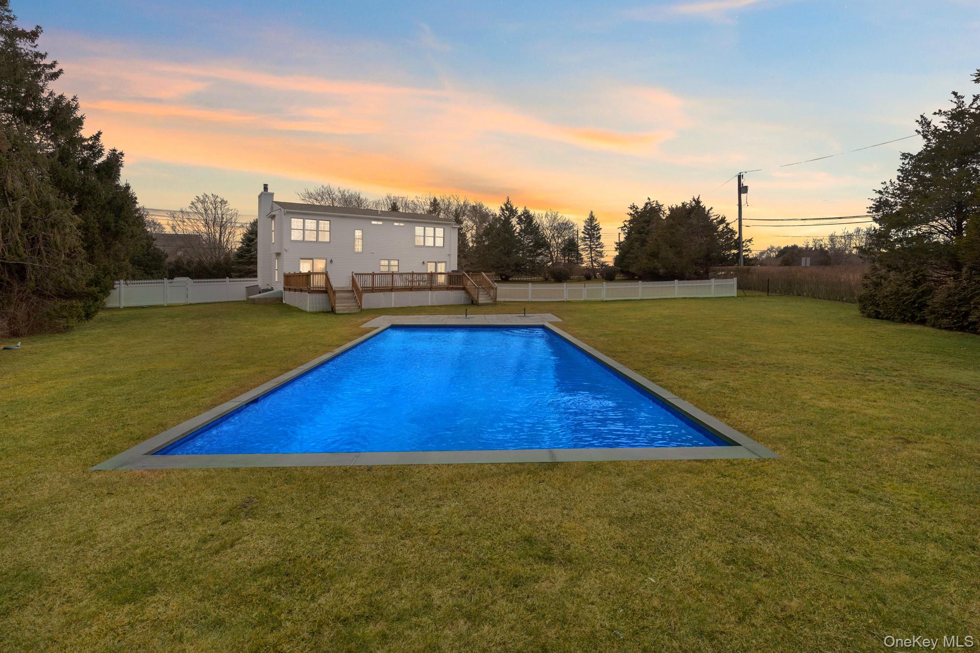 5 Lower 7 Ponds Road Water Mill, NY 11976 - Photo 3 of 35 Pool at dusk featuring a deck
