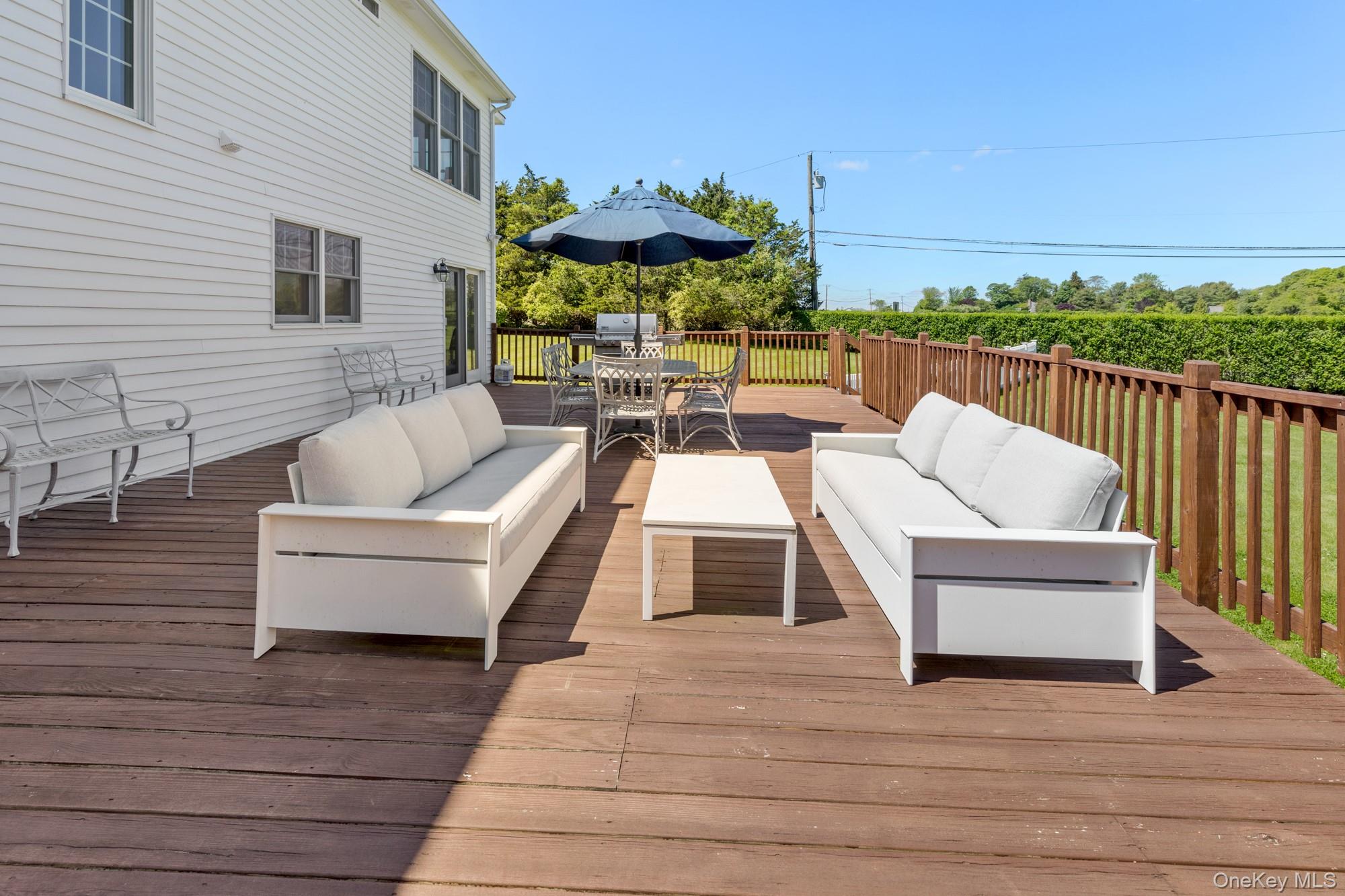5 Lower 7 Ponds Road Water Mill, NY 11976 - Photo 31 of 35 Deck featuring an outdoor hangout area and outdoor dining area