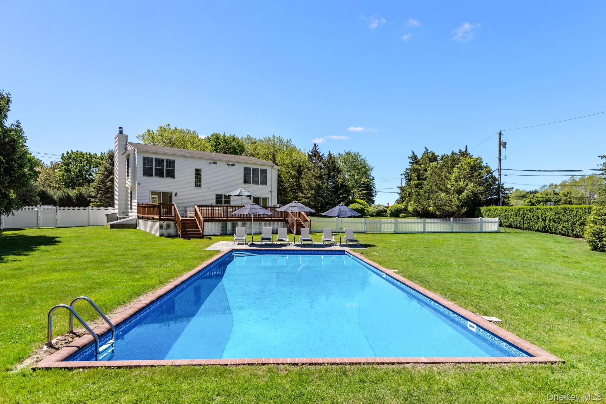 5 Lower 7 Ponds Road Water Mill, NY 11976 - Photo 33 of 35 View of swimming pool with a deck and stairs
