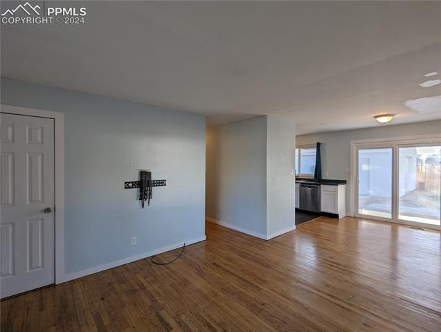 209 Kiva Road Colorado Springs, CO 80911 - Photo 3 of 6 Beautiful hardwood floors through the Living Room and Dining Room.
