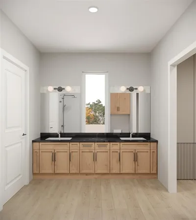 view of kitchen with cabinets and window