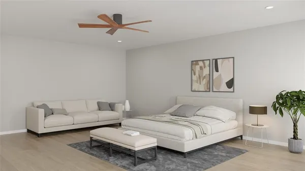 a bedroom with a bed and a couch