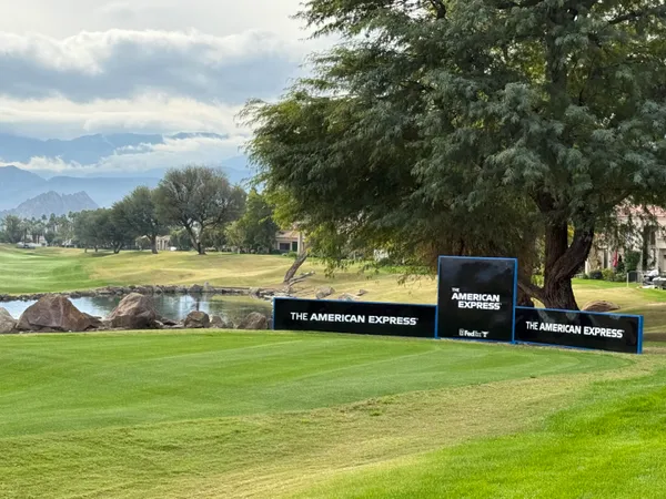 a view of a park with swings and slides