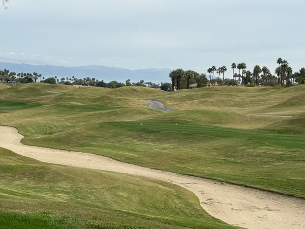 a view of patio with couches and pool
