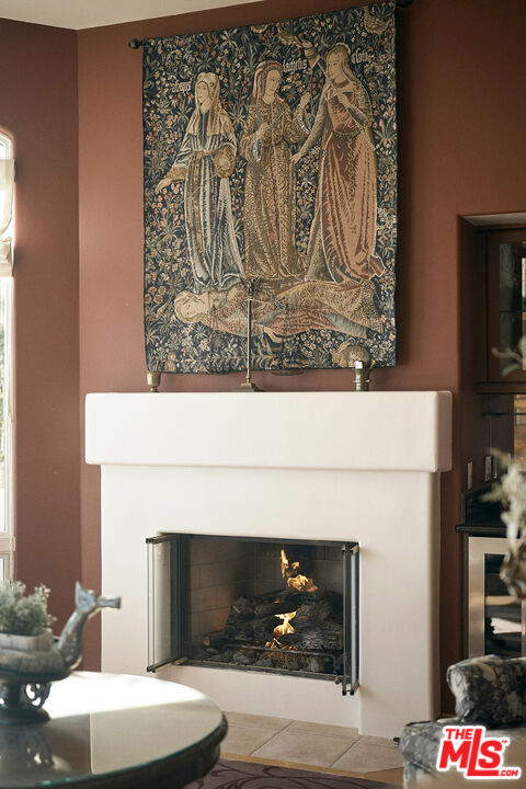 1643 La Vista Del Oceano Santa Barbara, CA 93109 - Photo 13 of 36 a living room with a fireplace