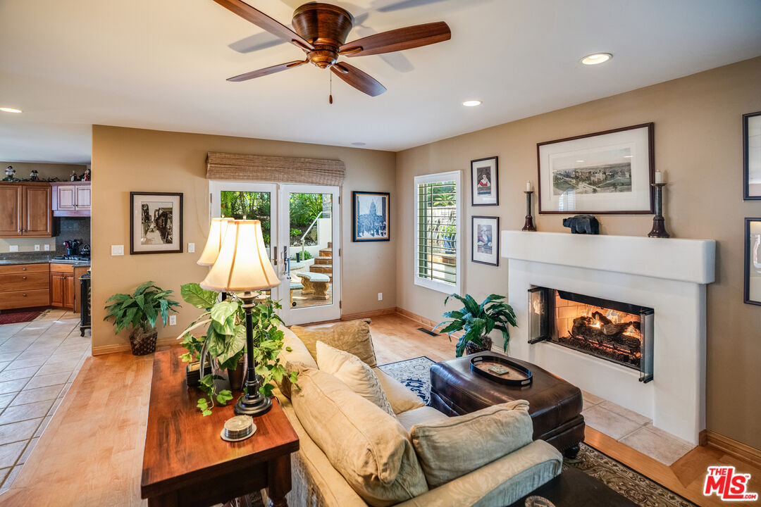 1643 La Vista Del Oceano Santa Barbara, CA 93109 - Photo 22 of 36 a living room with furniture fireplace and a large window