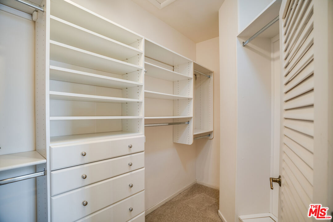 1643 La Vista Del Oceano Santa Barbara, CA 93109 - Photo 25 of 36 a view of walk in closet with empty racks