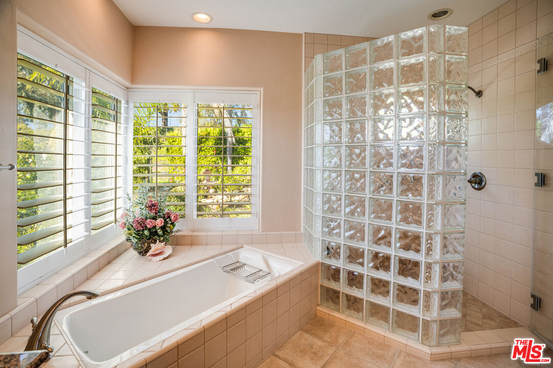 1643 La Vista Del Oceano Santa Barbara, CA 93109 - Photo 26 of 36 a bath tub sitting in a bathroom next to a window