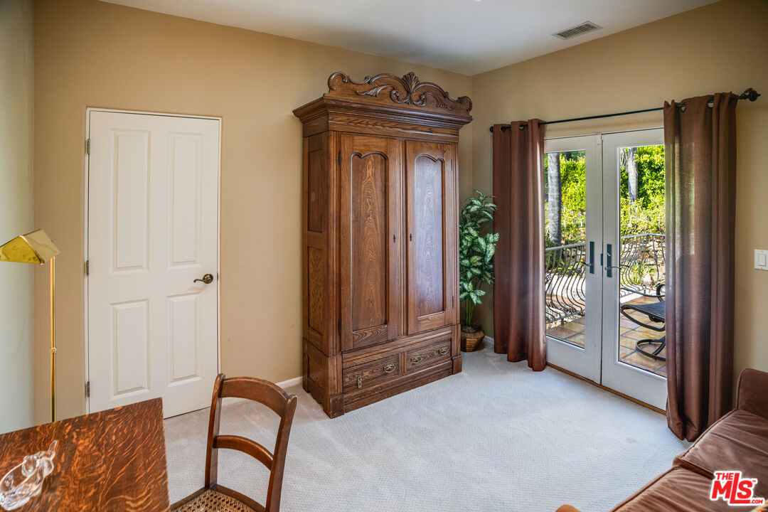 1643 La Vista Del Oceano Santa Barbara, CA 93109 - Photo 28 of 36 a view of a hallway with furniture and a window