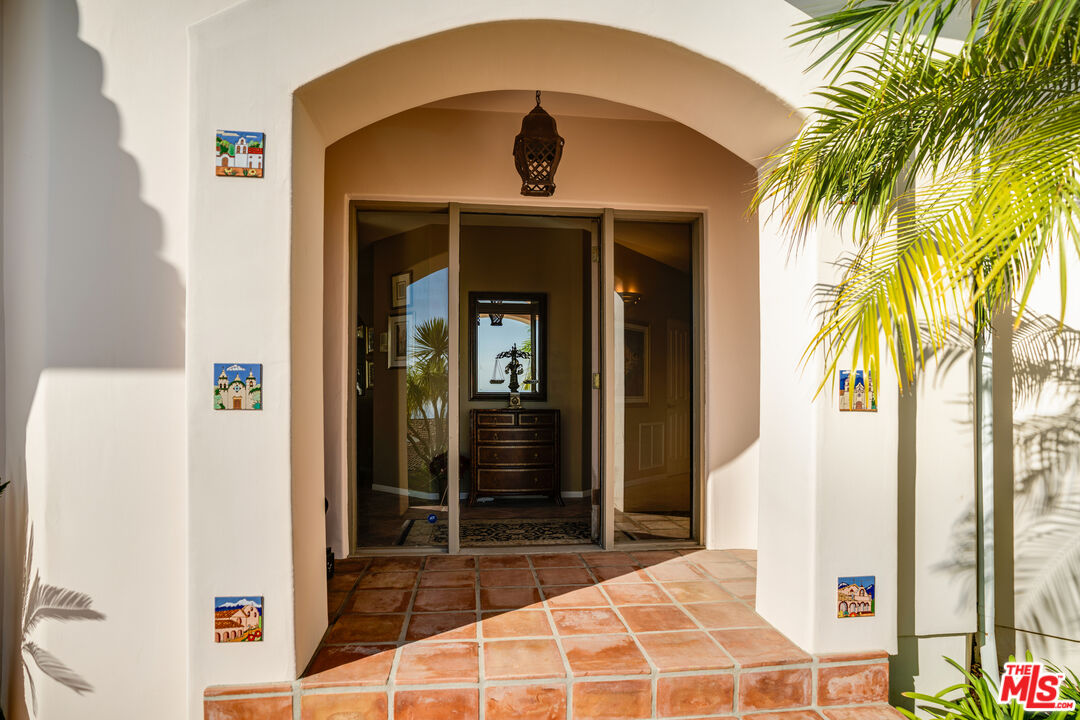 1643 La Vista Del Oceano Santa Barbara, CA 93109 - Photo 30 of 36 a bedroom with a bed and a potted plant